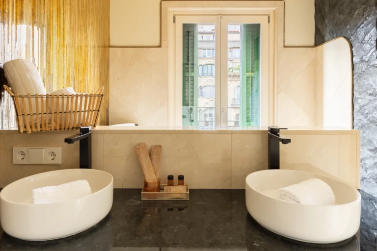 The bathroom has a view of the Rambla Catalunya